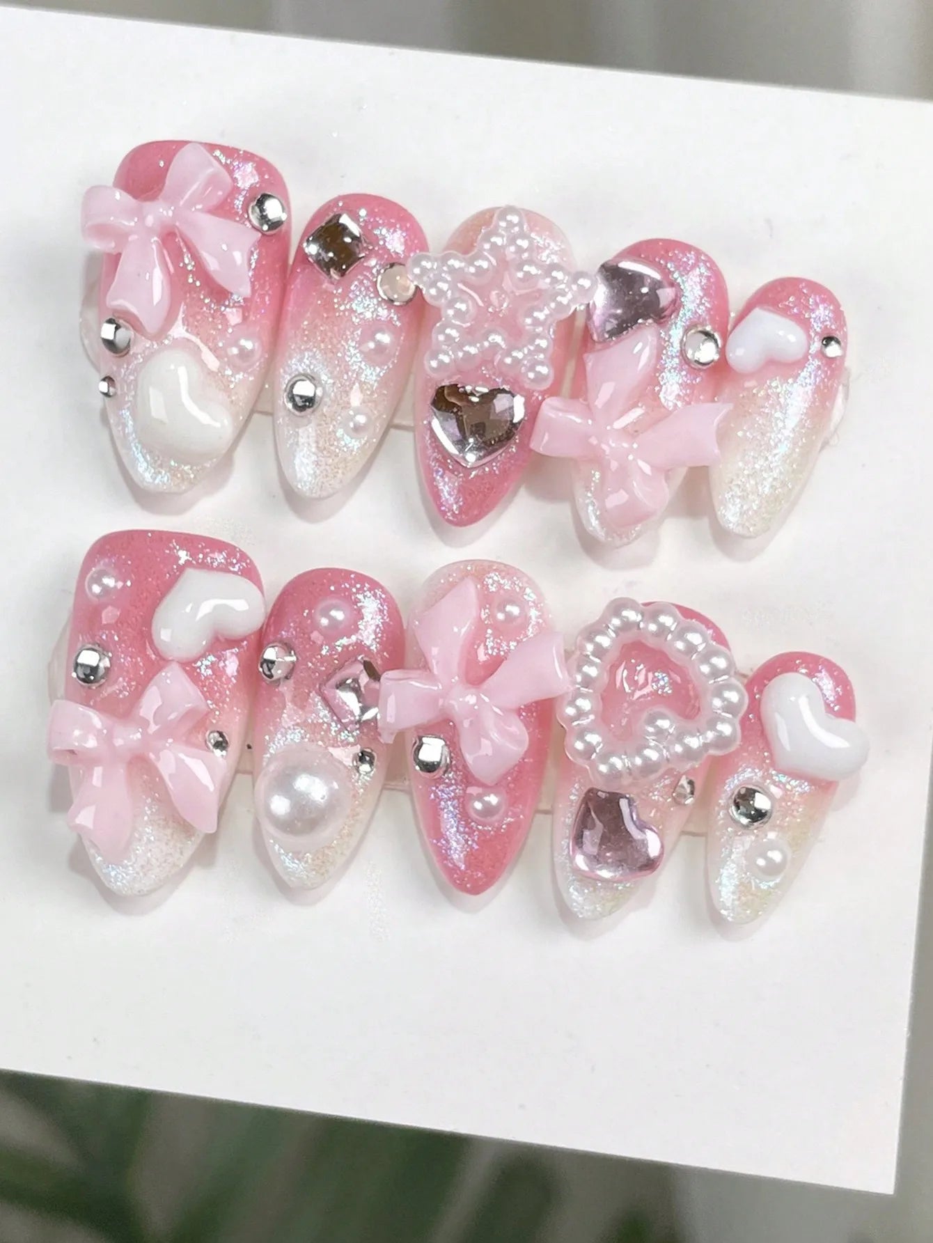 Peach Pink Gradient Rhinestone Bowknot Press-On Nails, 10-Piece Set, Transitioning from Peach Pink to Milky White from Top to Bottom, with Fine Shimmering Aurora Silver Powder Covering the Nail Surface, a Shimmering Jelly-Lik