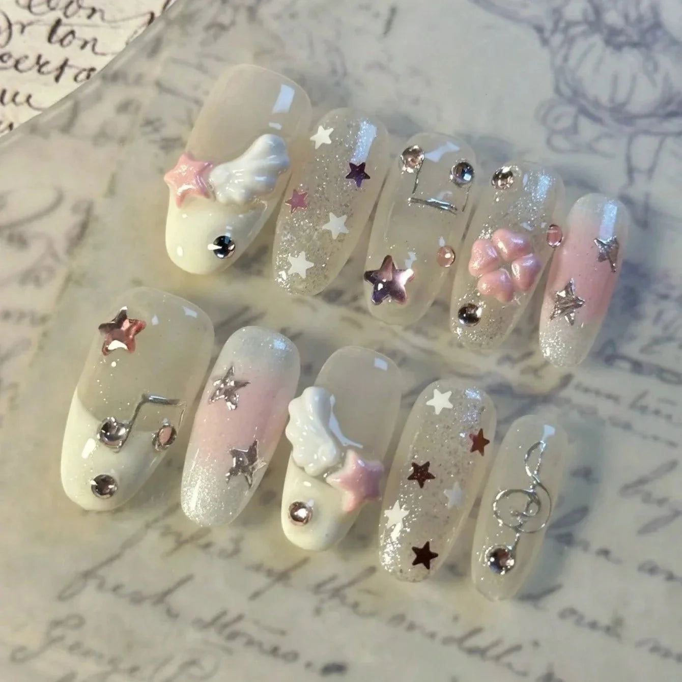 10 pieces of hand-pressed almond-shaped nails, beautiful fake nails, with angel wing notes, suitable for women